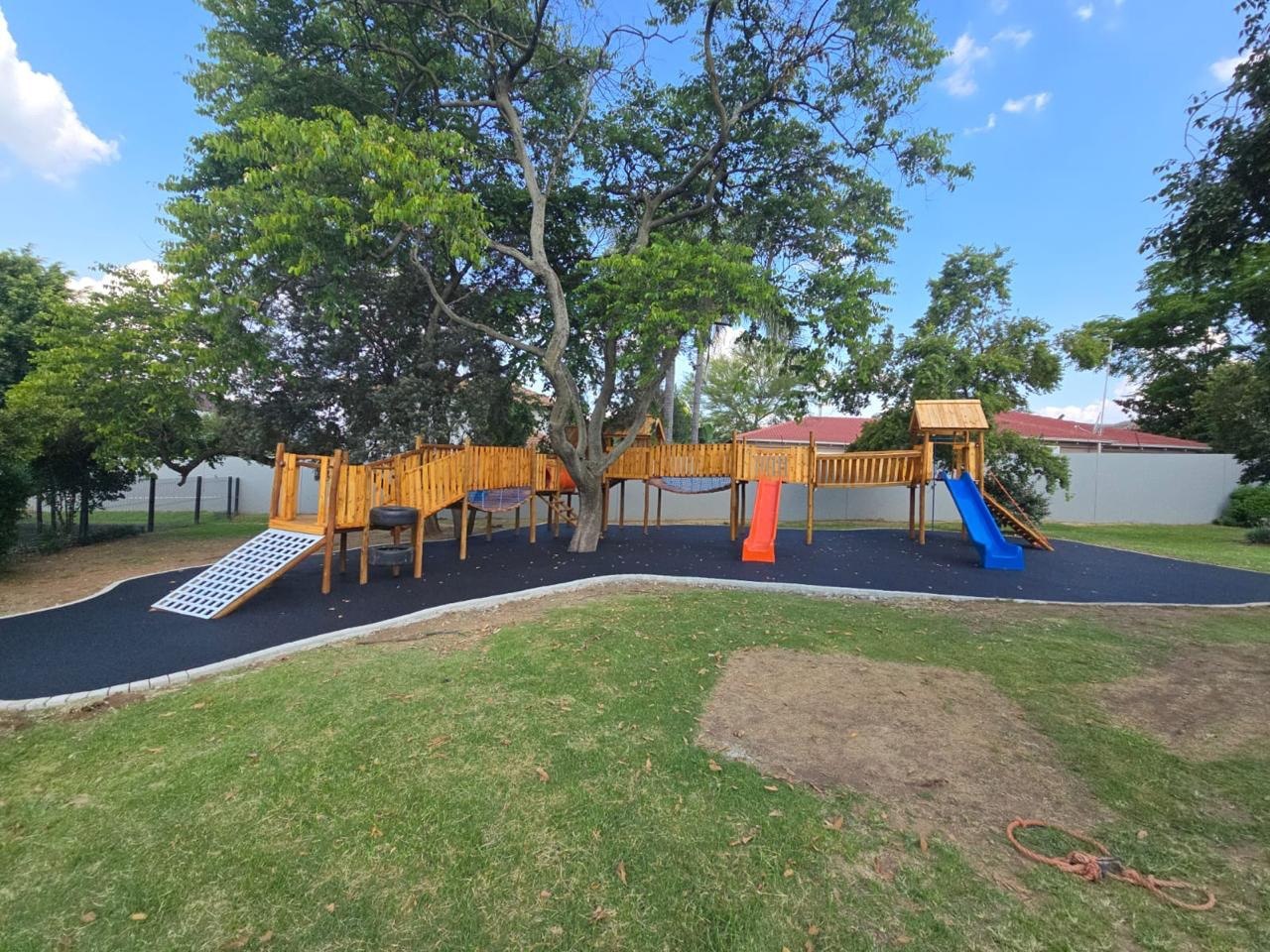 Jungle gym on black rubber safety surfacing